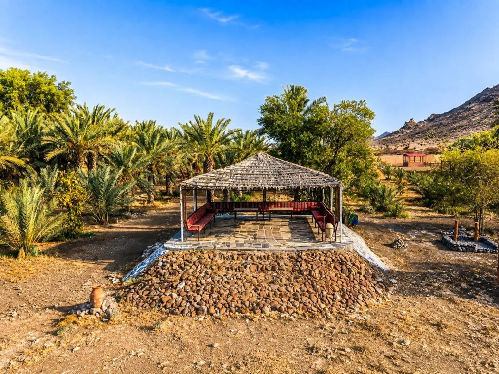 Escape to Nature Resort in Mahdha Oman with palm trees, gardens and bungalow accommodation