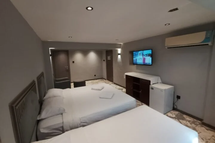 Sur Hotel Family Triple Room Sur Oman one large bed and one single bed for couple with child (10)